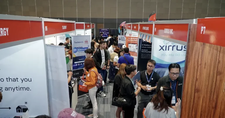 Entrepreneurs visiting technology and digital solutions exhibitors at the PHILSME Business Expo in Manila.