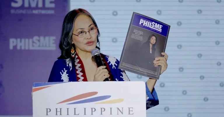 PHILSME Media Director and Editor Angie Quadra-Balibay unveils the inaugural PHILSME Business Magazine during the opening program of the 18th PHILSME Business Expo & Conference at SMX Convention Center Manila.